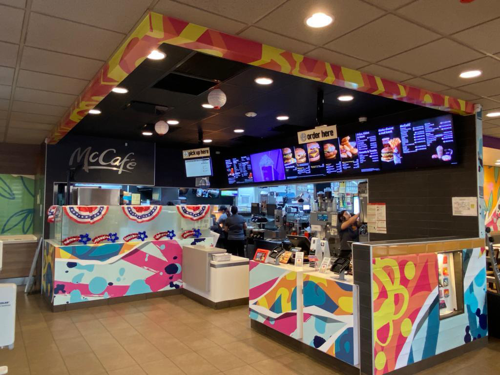 Photo of McDonald’s restaurant inside mural wrapped by Christopher J. Gonzalez