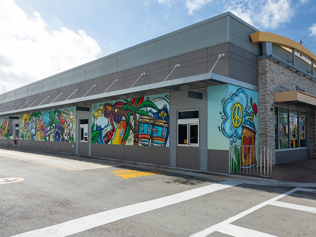 Photo of McDonald’s restaurant side mural wrapped by Carlos Solano
