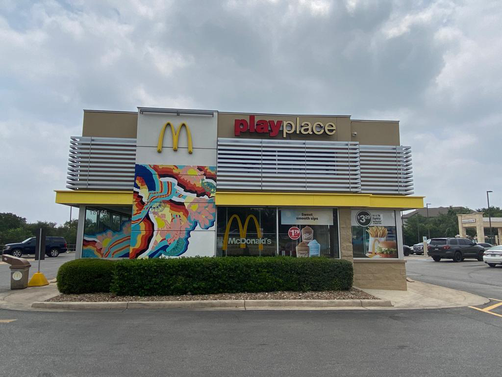 Photo of McDonald’s restaurant front mural wrapped by Manola and Maria